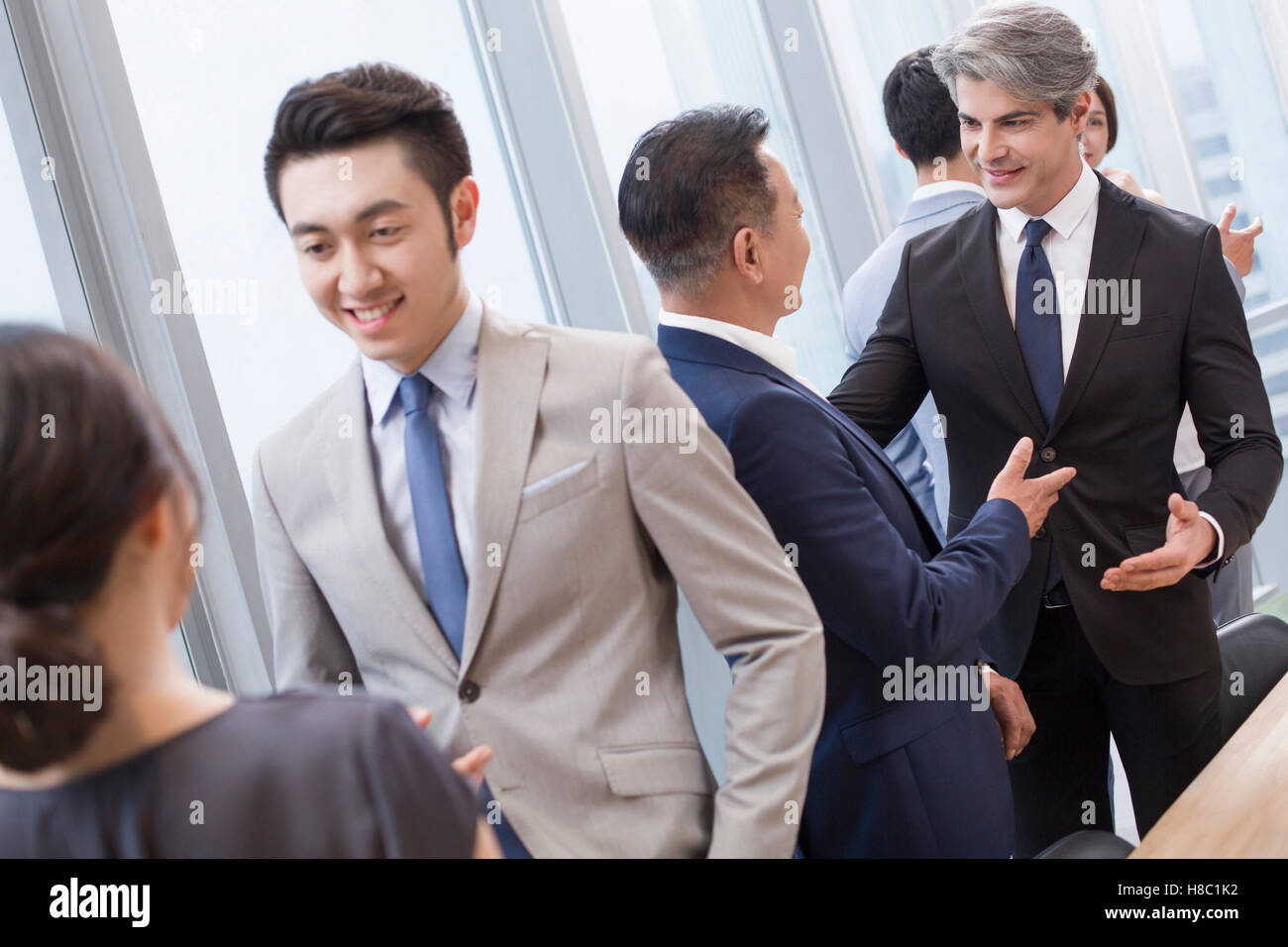 Chinese business people talking in meeting room Stock Photo Alamy