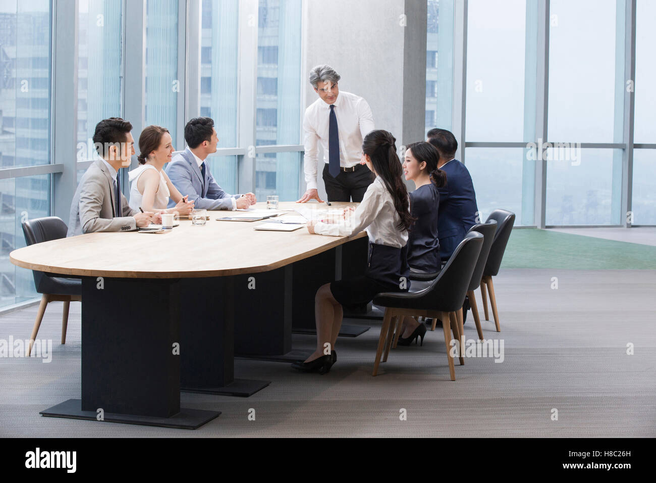 Chinese business people having meeting in board room Stock Photo Alamy