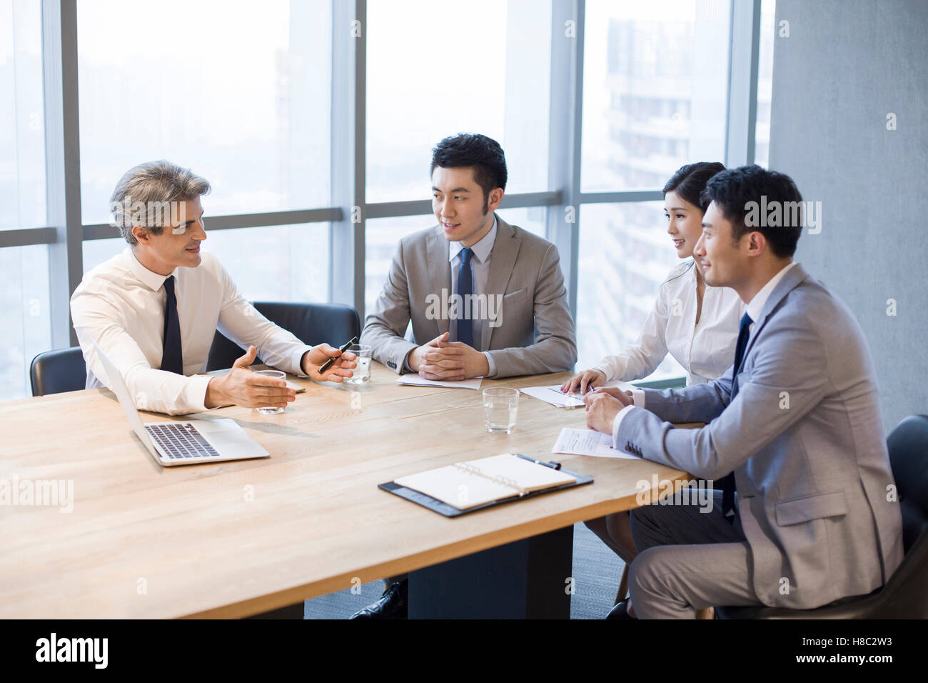Chinese business people having meeting in board room Stock Photo Alamy