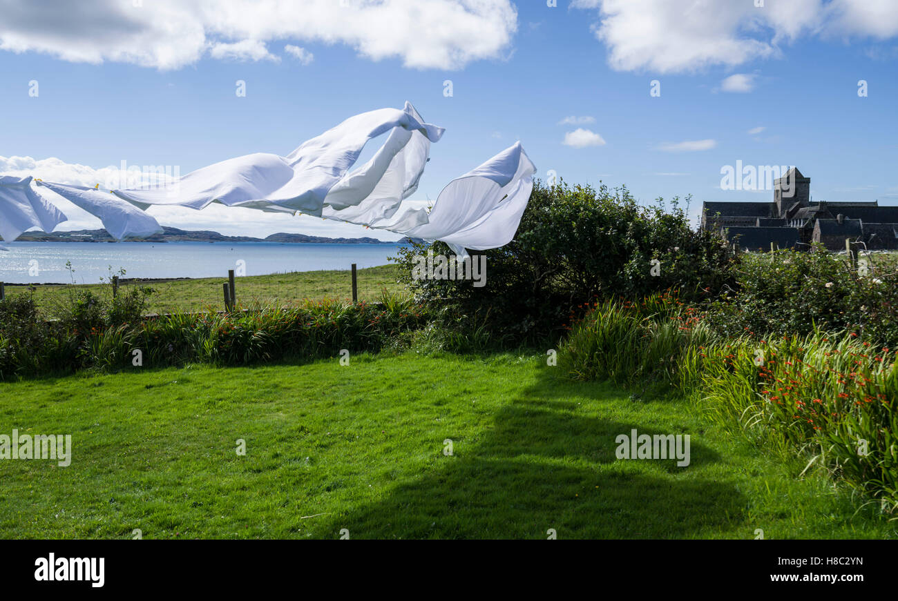 Iona, Scotland - Grianan, holiday rental house near the Abbey. Washing drying on the line in the wind. Stock Photo