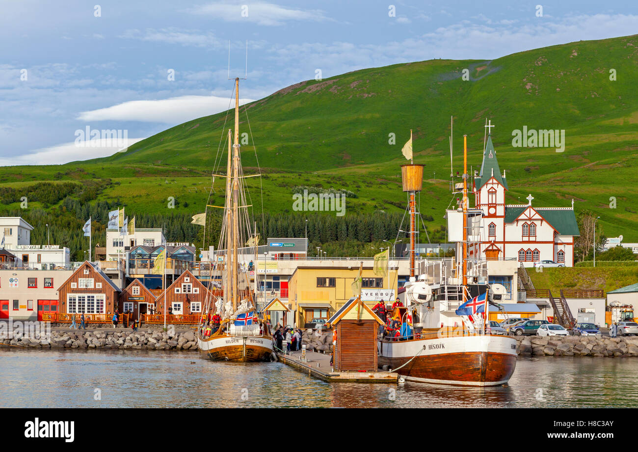 A view of fishing and tourist boats in the Husavik bay in Iceland Stock