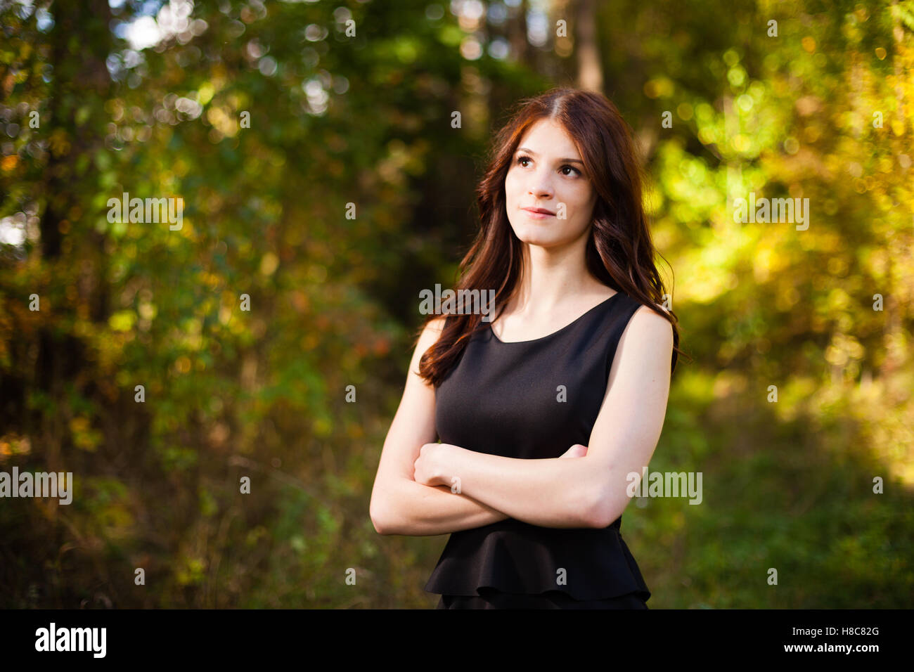 Long hair girl in a dress at forest. Stock Photo