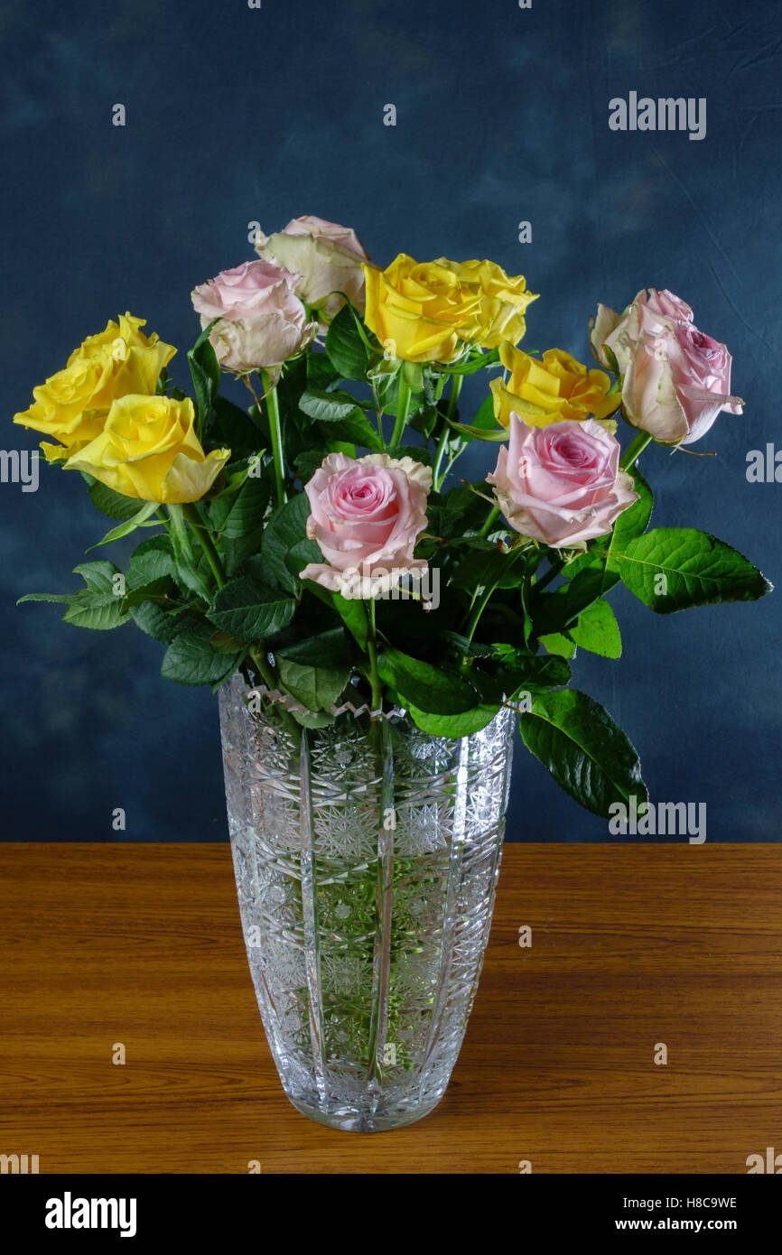 Large Edinburgh Crystal vase with cut roses Stock Photo Alamy