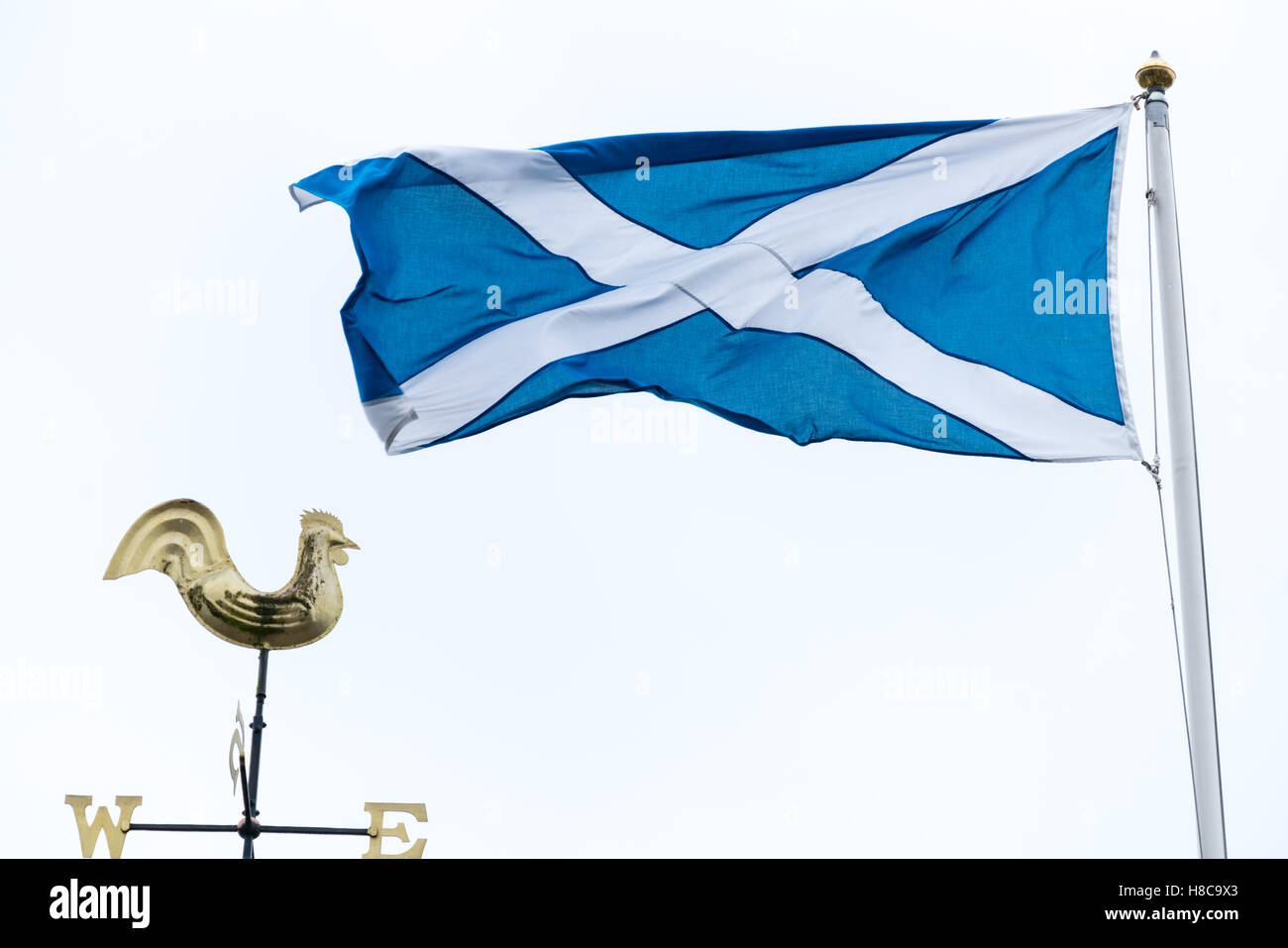 The wind comes from the east to blow the Scottish Saltire flag towards the west Stock Photo