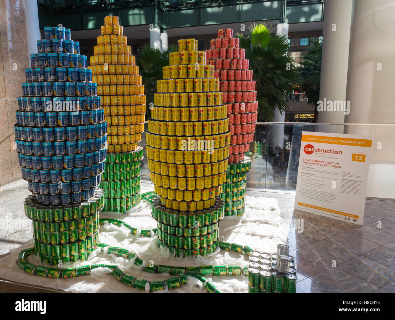Shine a Bright Light on the Darkness of Hunger by AKF Group in the 24th annual Canstruction Design Competition in New York, seen on Friday, November 4, 2016, on display in Brookfield Place. The sculpture is made of 4272 cans and will feed 3416 New Yorkers. Architecture and design firm participate to design and build giant structures made from cans of food.  The cans are donated to City Harvest at the close of the exhibit. Over 100,000 cans of food were collected and will be used to feed the needy at 500 soup kitchens and food pantries. (© Richard B. Levine) Stock Photo