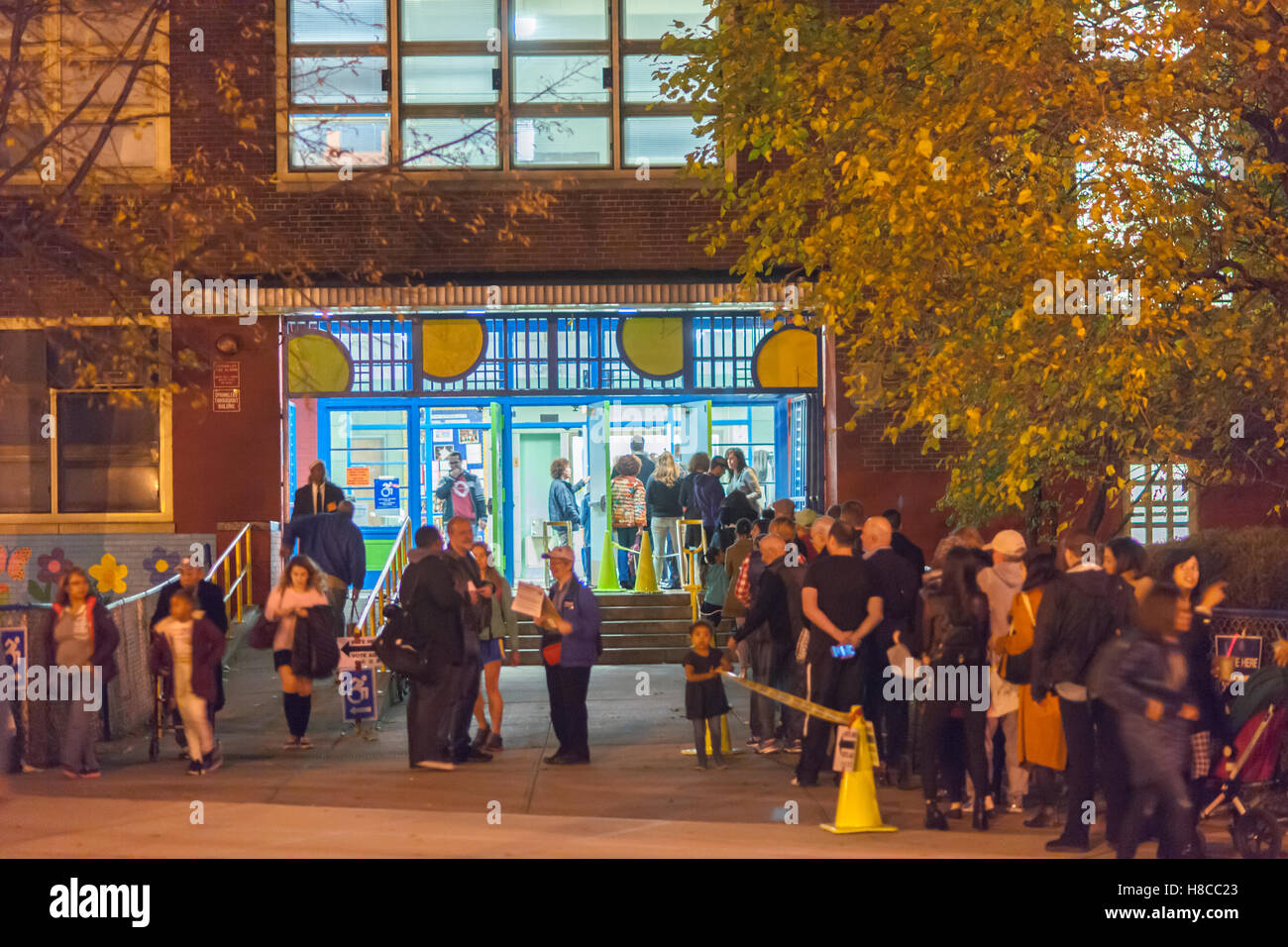 Voters enter and leave the PS33 polling station in the Chelsea neighborhood of New York on the evening of Election Day, Tuesday, November 8, 2016. (© Richard B. Levine) Stock Photo
