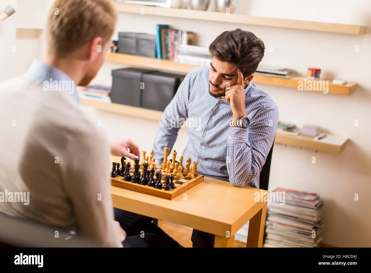 Two guys playing chess Stock Photo by ©MichalLudwiczak 74522861