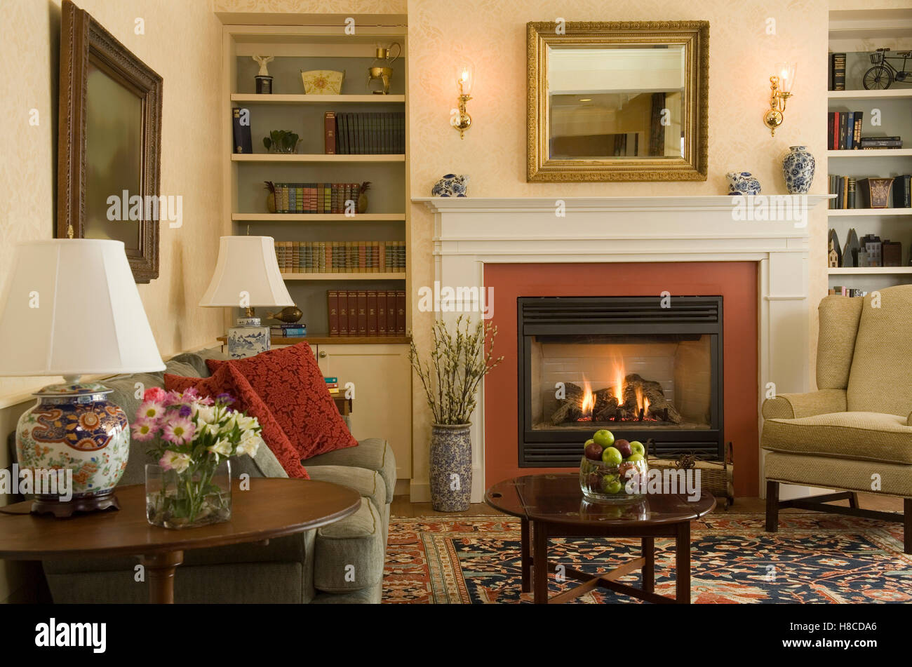 Country Style Sitting Room With Sofa And Armchairs And Fireplace