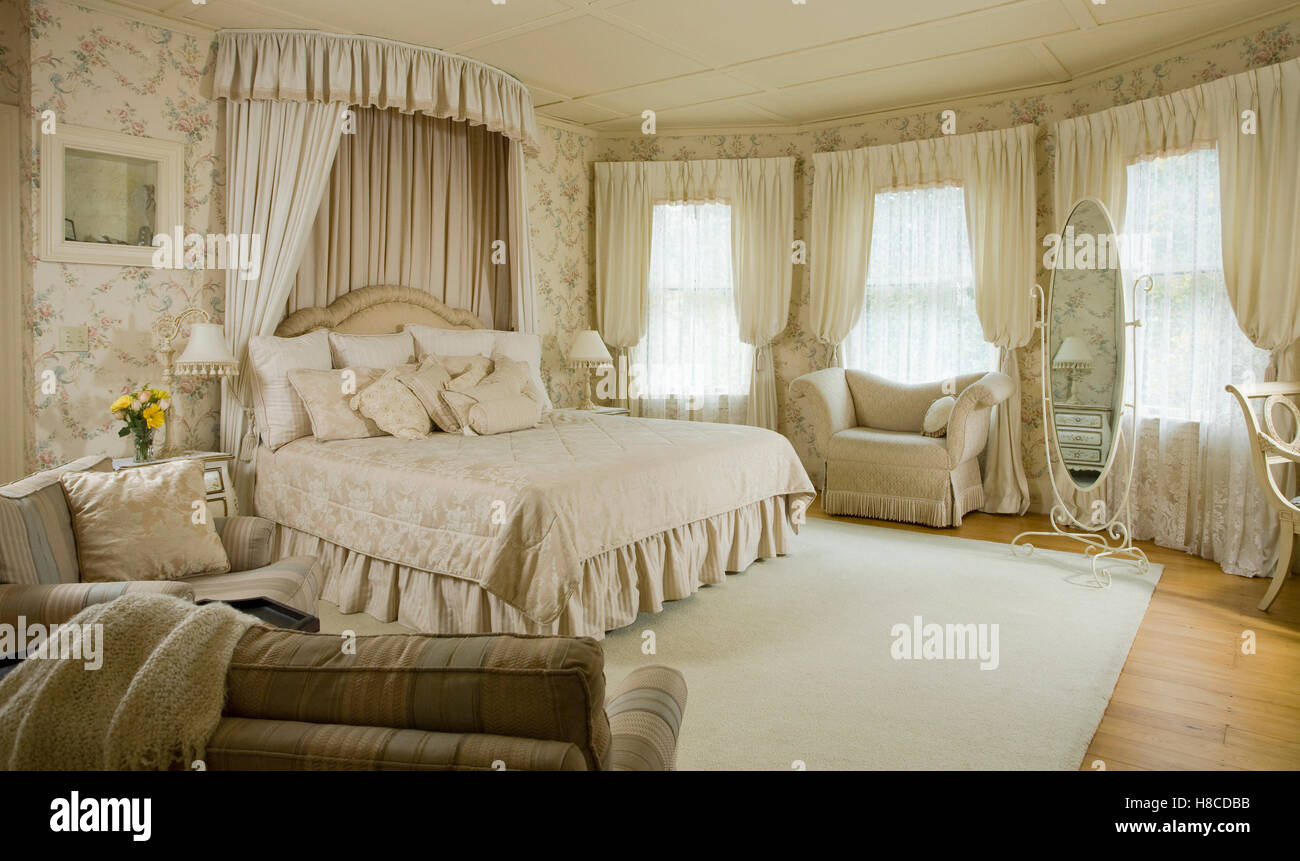 Fabric canopy above double bed in spacious bedroom Stock Photo Alamy
