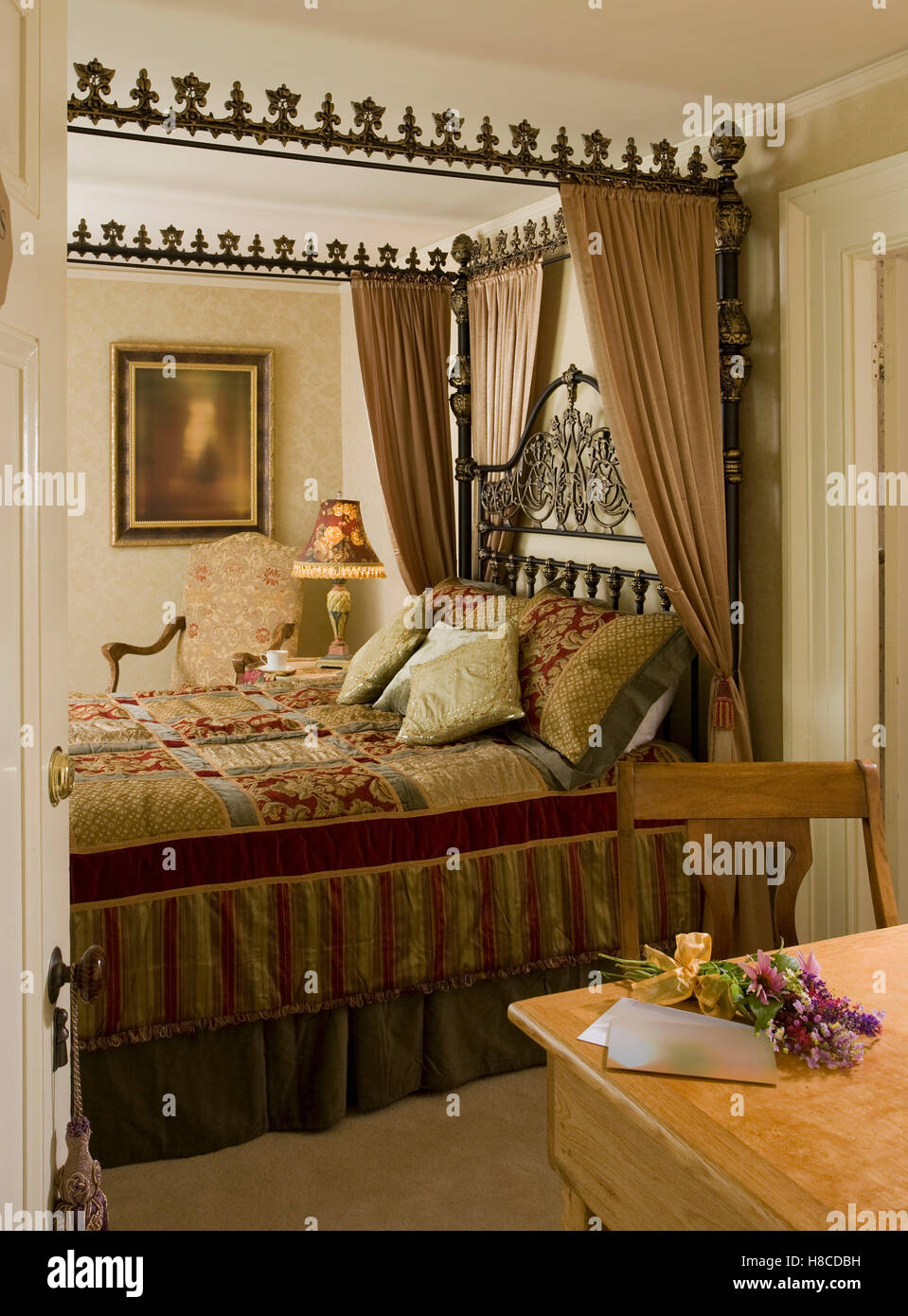 Ornate four poster bed with curtains Stock Photo - Alamy
