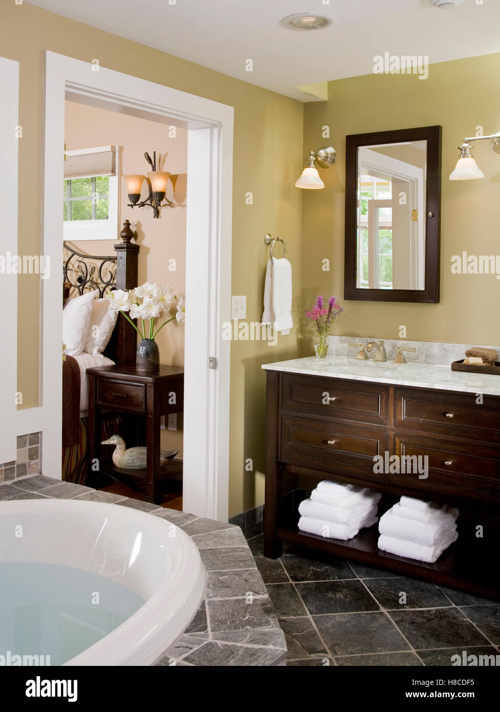 Bathroom with tiled floor and mahogany storage unit, New Hampshire, USA. Stock Photo