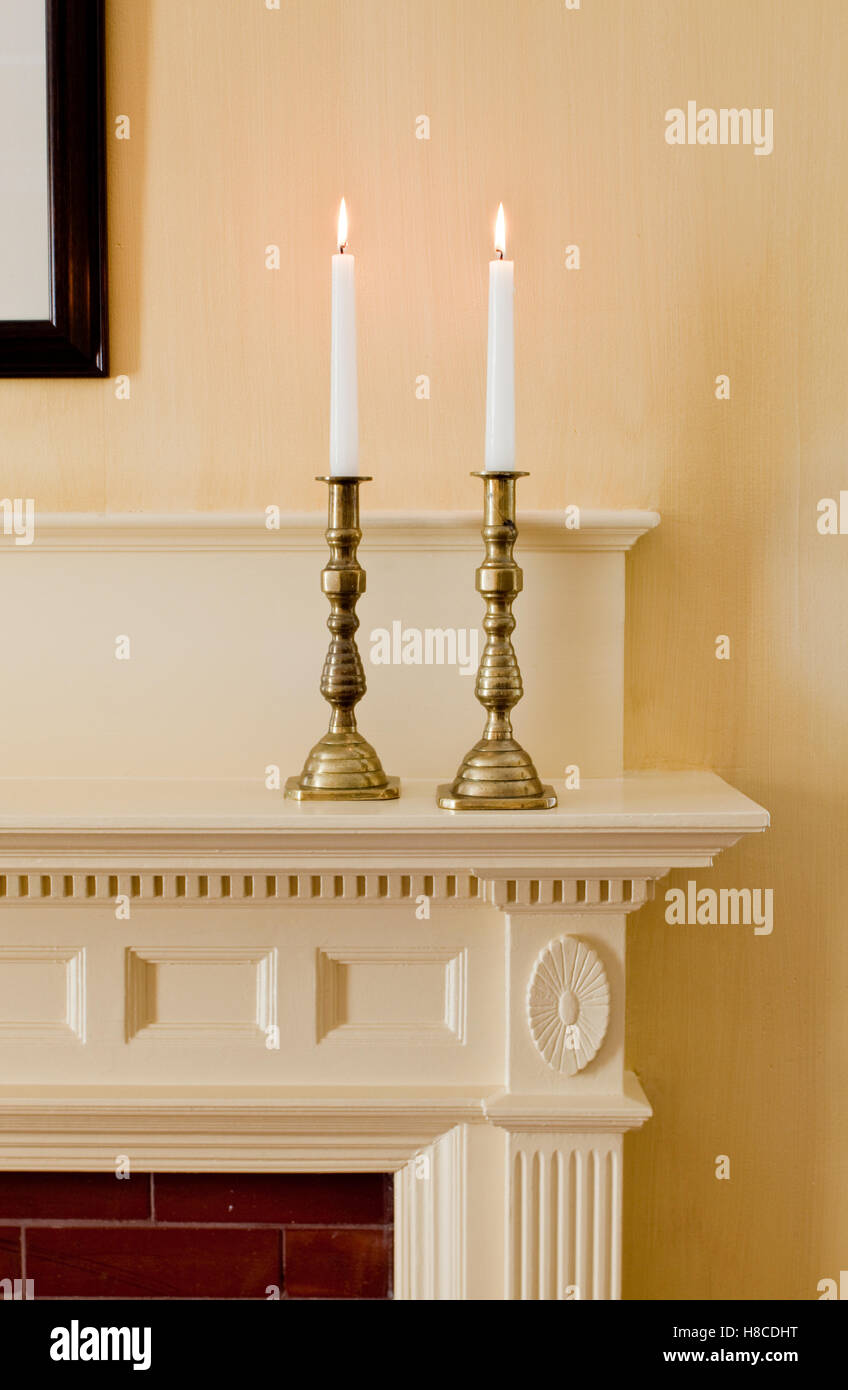 Candles burning on mantle Stock Photo Alamy