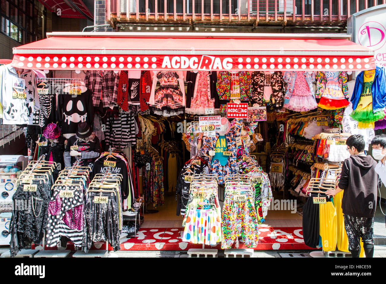 Japan, Tokyo, Harajuku, Takeshita-dori. Famous ACDC Rag, gothic lolita fashion store. Entrance crammed with racks of kawaii, cute, clothing. Stock Photo