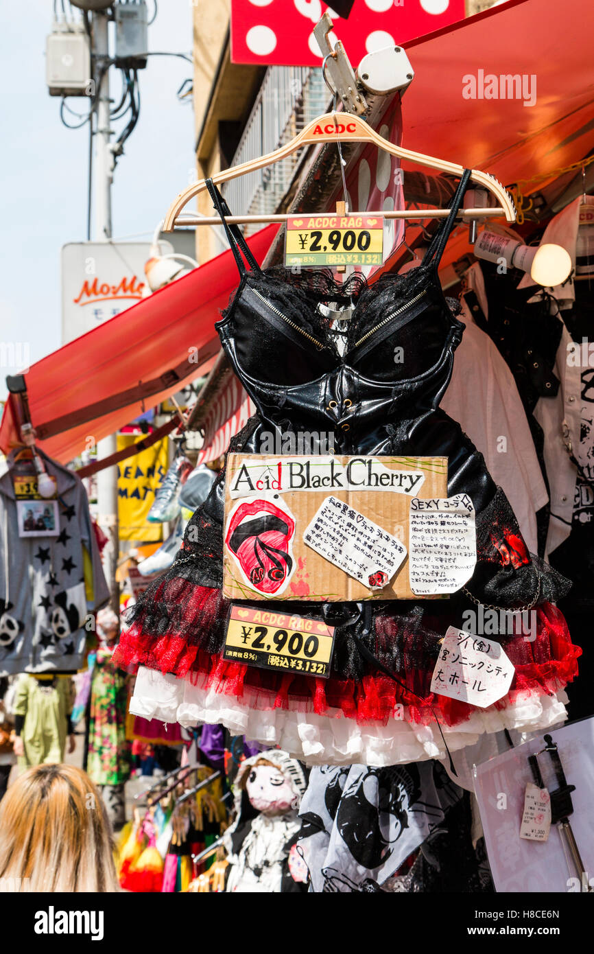 Japan, Tokyo, Harajuku, Takeshita-dori. Famous ACDC Rag, gothic lolita store. Acid Black Cherry black bodice with frilly red and white skirt. Stock Photo
