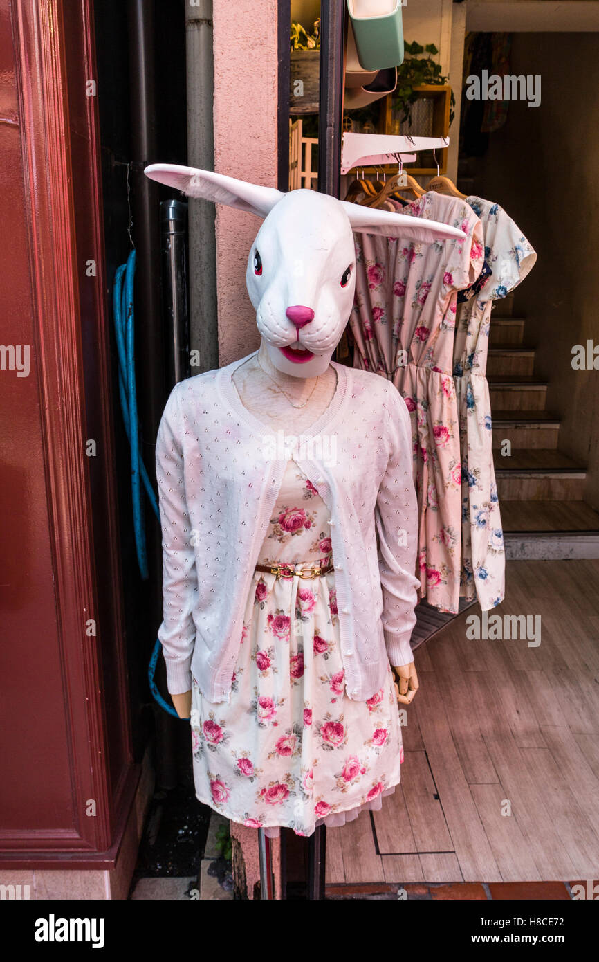 Japan, Tokyo, Harajuku, Takeshita-dori. Iconic mannakin with rabbit head and pink and white dress outside famous ACDC Rag trendy fashion store. Stock Photo