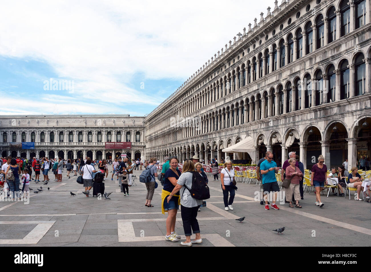Tourists on the Piazza San Marco of Venice in Italy. Stock Photo