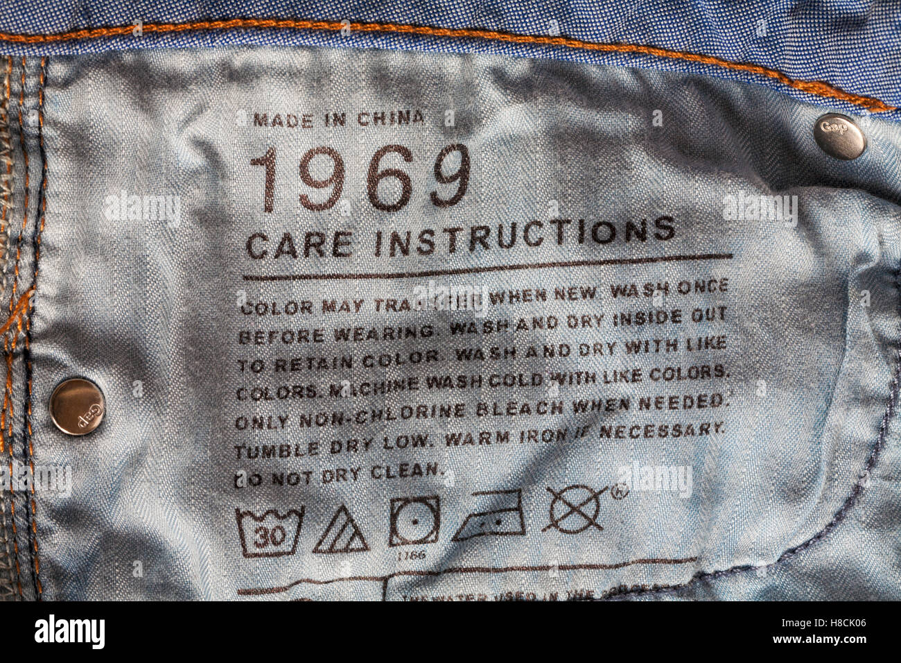 Care instructions stamped in GAP 1969 denim jeans made in China Stock Photo