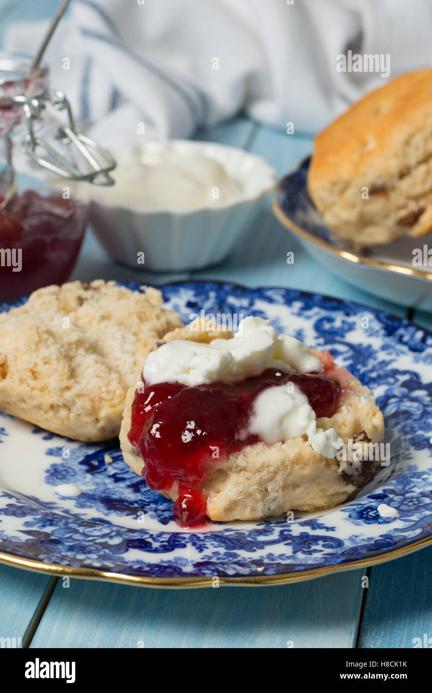 Close up of cream scone with jam on vintage china plate Stock Photo - Alamy