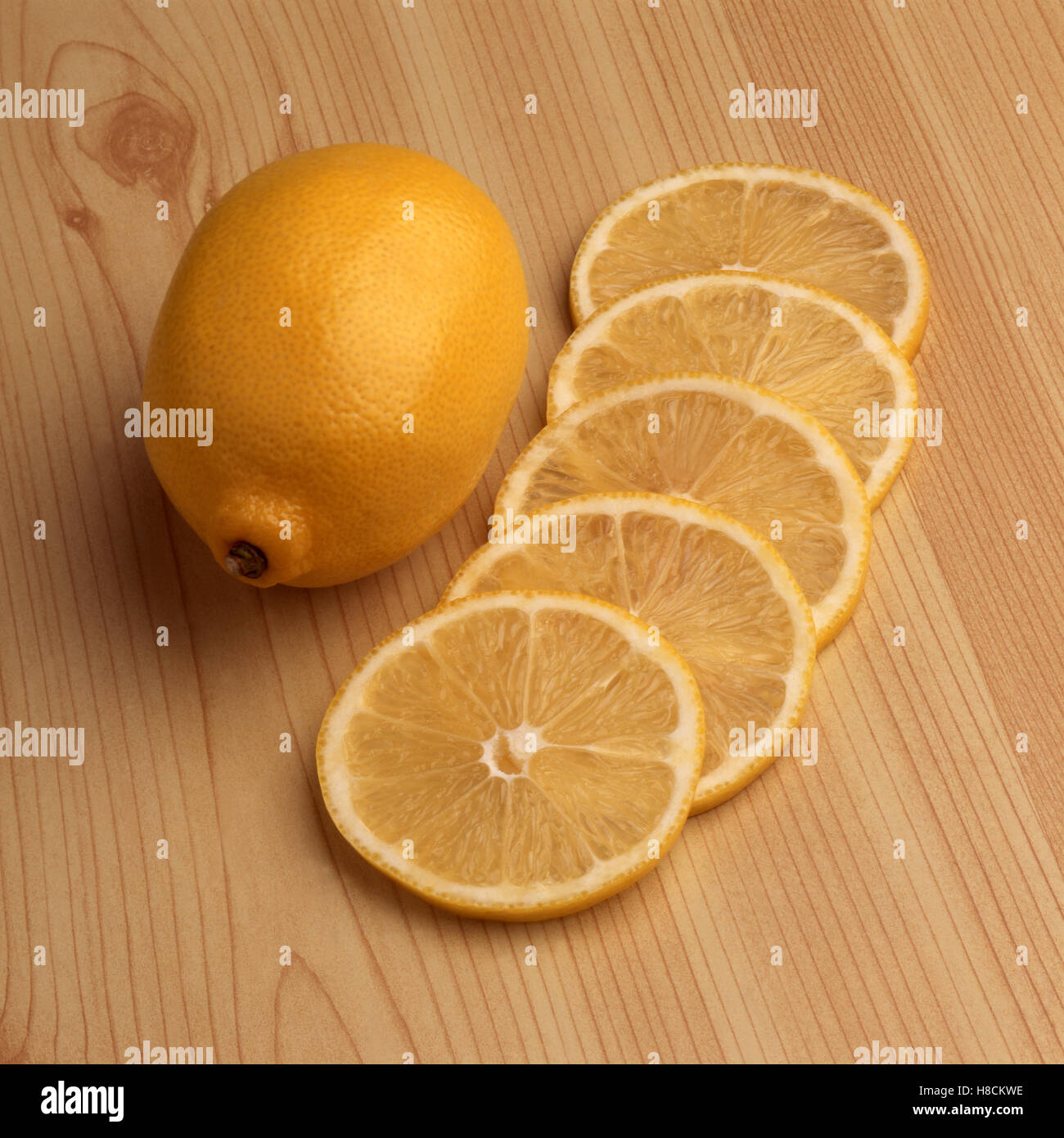 Lemon and five slices Stock Photo