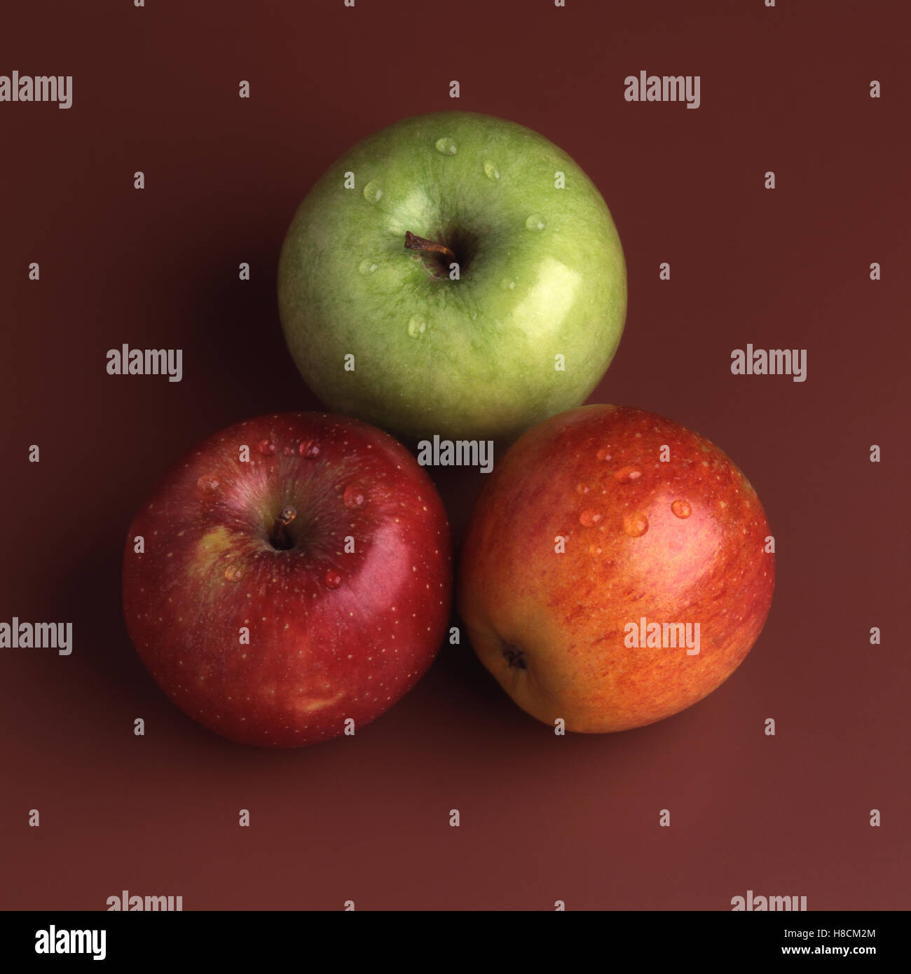 Three Eating Apples Stock Photo Alamy