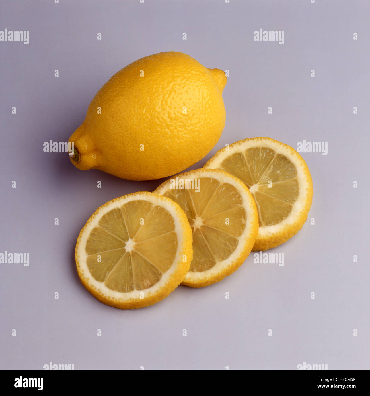 Lemon and three slices Stock Photo