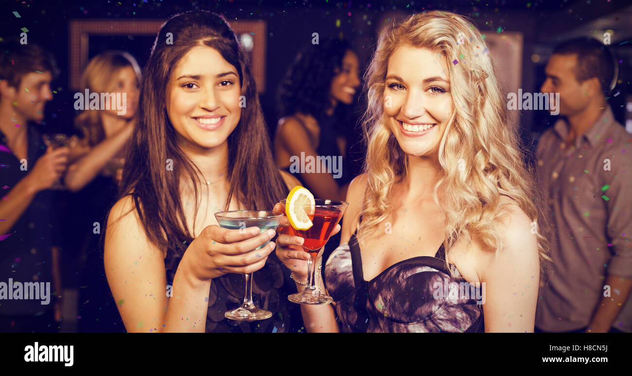 Composite image of portrait of friends having a drink Stock Photo