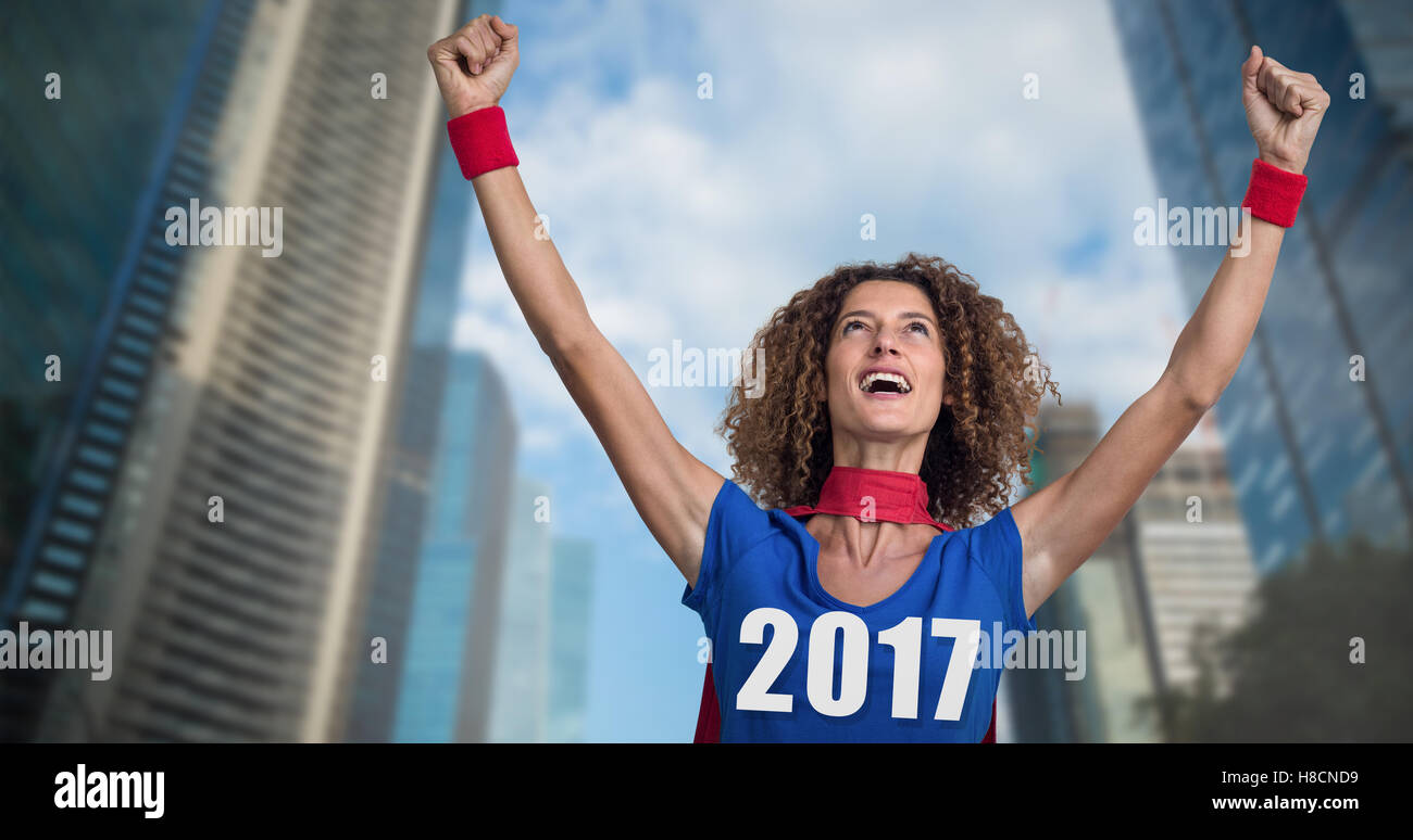 Composite image of woman pretending to be superhero Stock Photo
