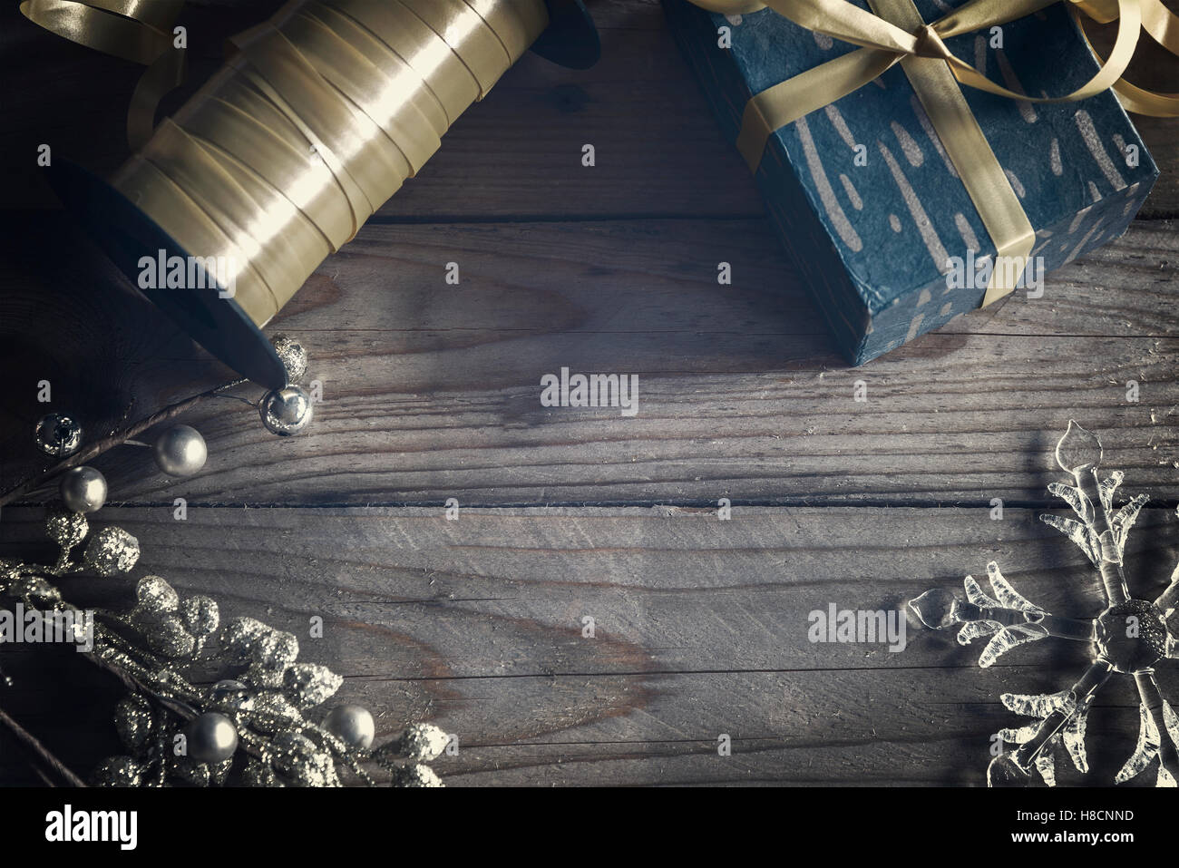 Image of christmas objects flatlay on wooden background. Stock Photo