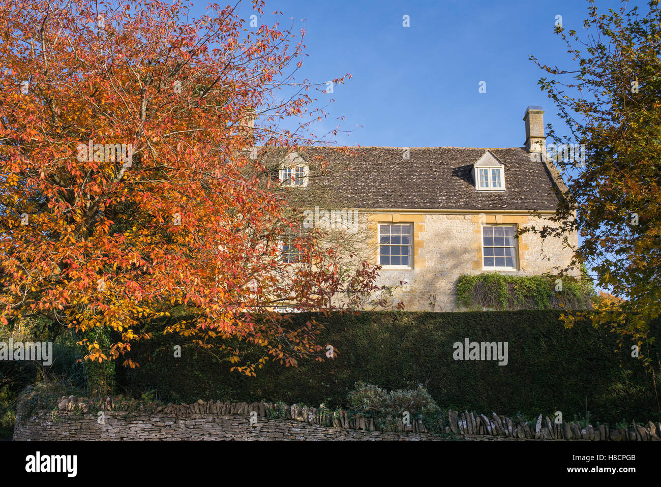 House in Adlestrop in autumn. Adlestrop. Cotswolds, Gloucestershire, England Stock Photo