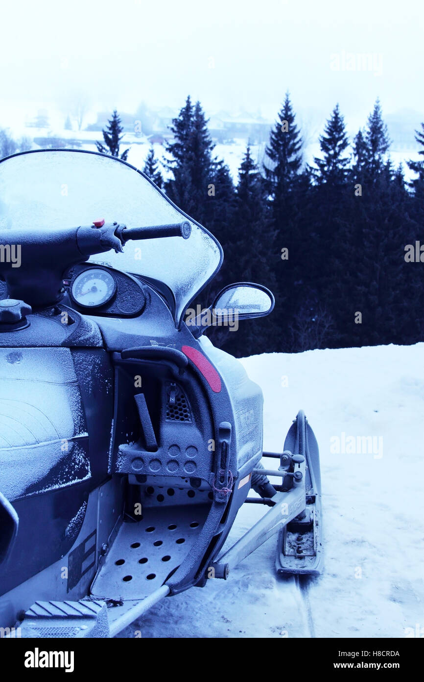 Side view of Snowmobile in winter mountains with forest Stock Photo - Alamy