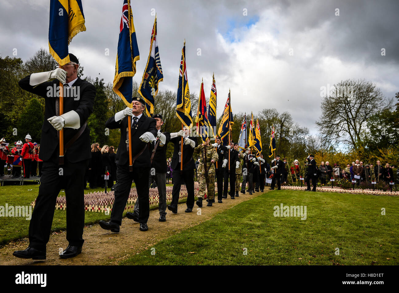 Royal British Legion standard bearers march past during a service for the opening of the Field of Remembrance at Royal Wootton Bassett, near Swindon. Stock Photo