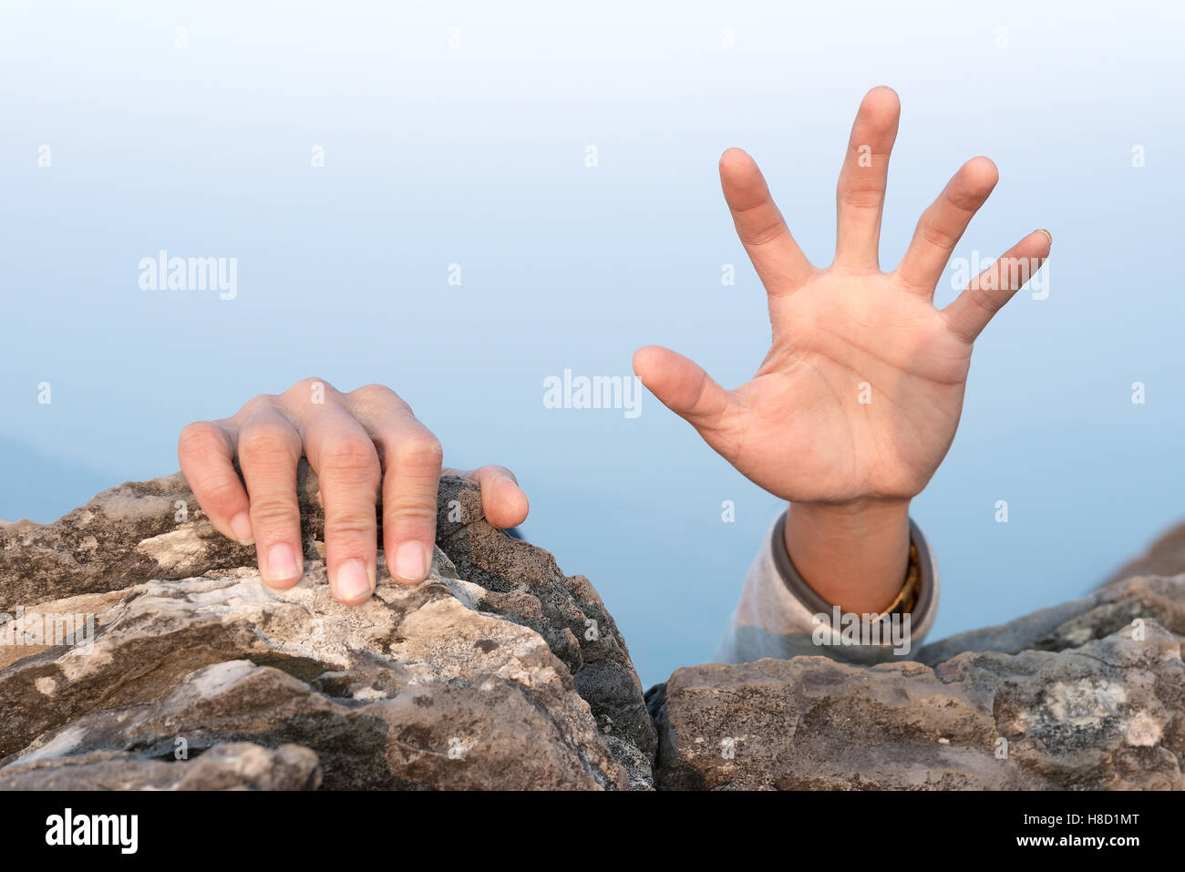 hands for help rock climbing Stock Photo - Alamy