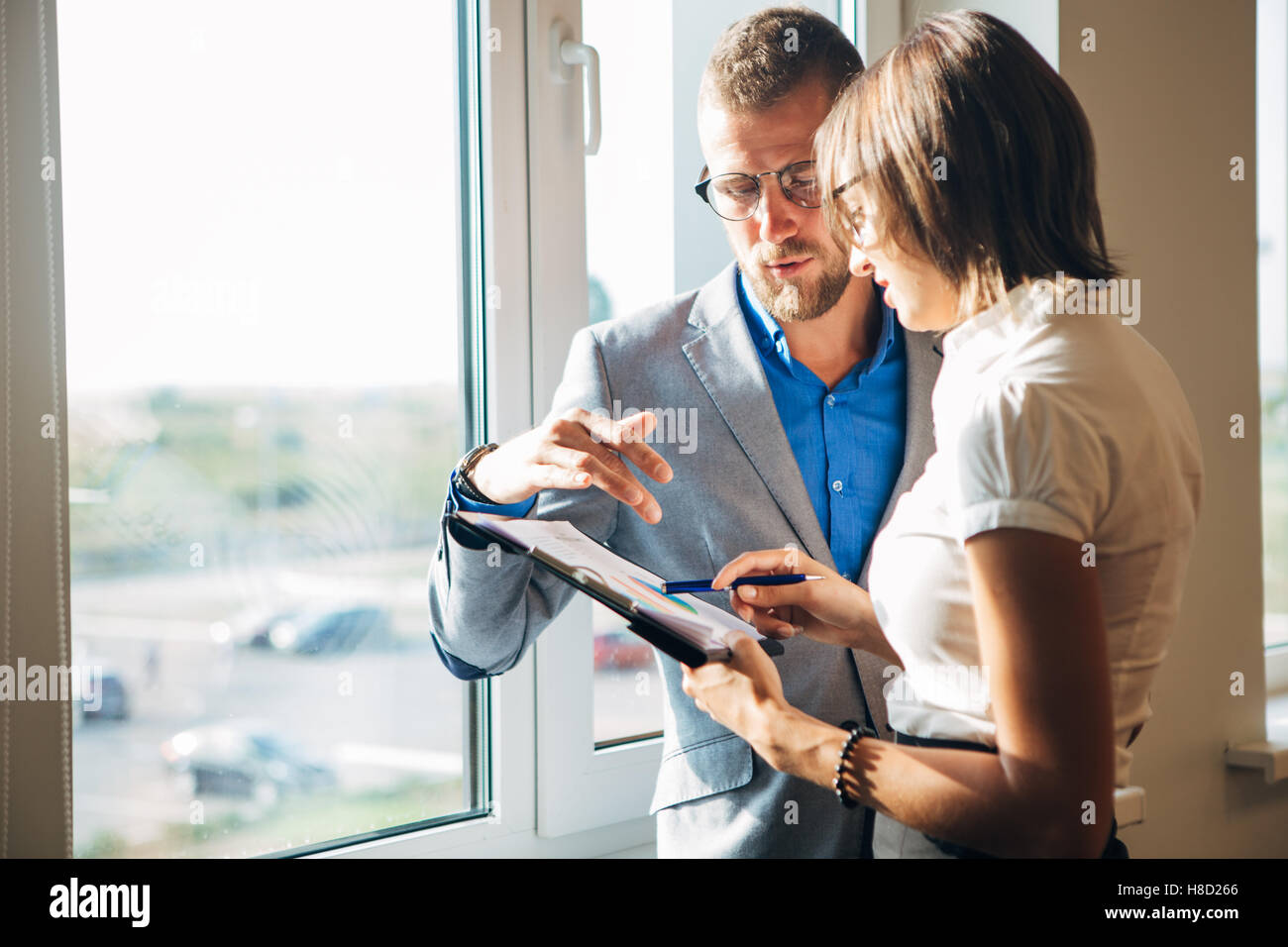 Two colleagues discussing a business idea in the office Stock Photo