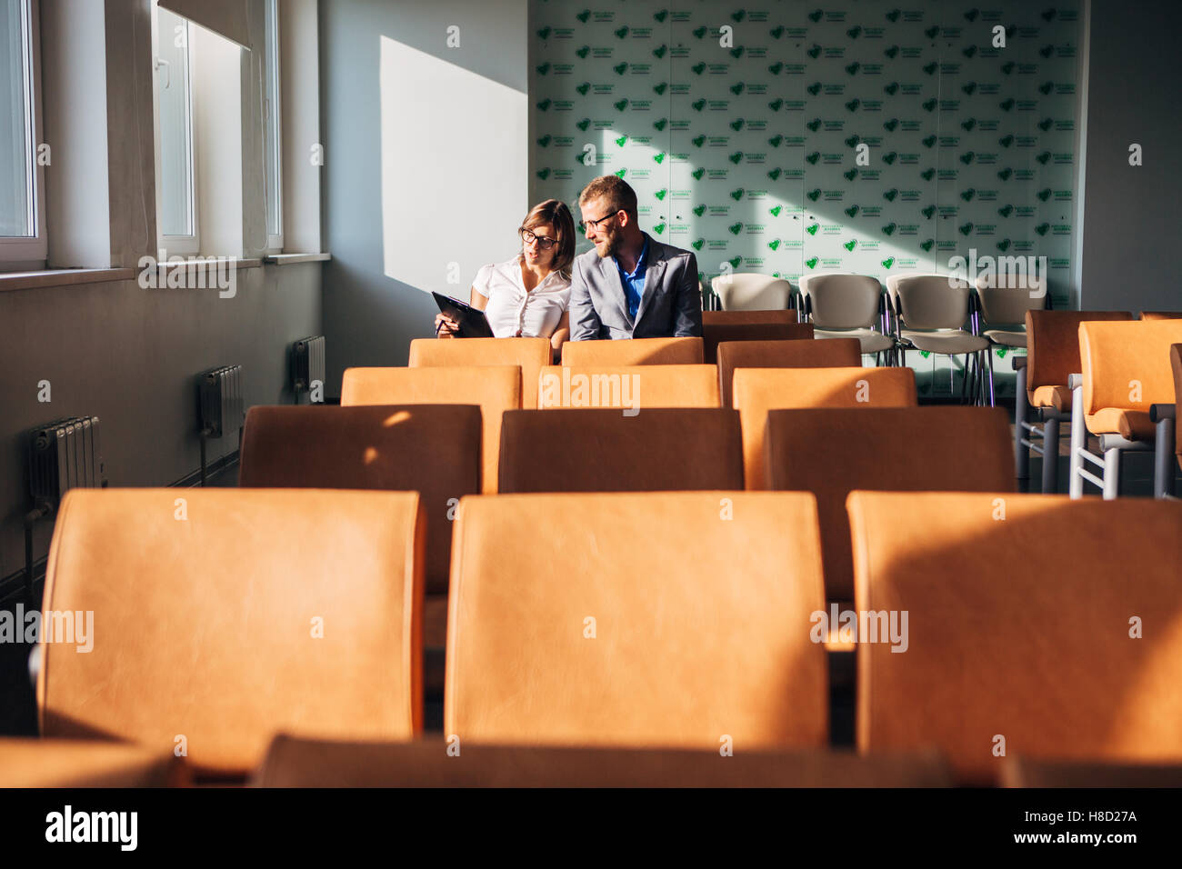 Two colleagues discussing a business idea in the office Stock Photo