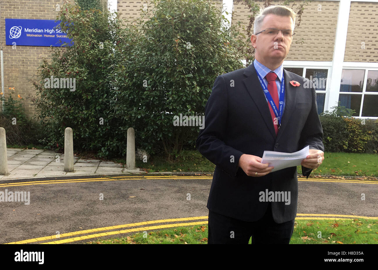 BEST QUALITY AVAILABLE Martin Giles, headteacher of Meridian High School, reads a statement outside the school in Croydon regarding the involvement of four ex-pupils in yesterday's tram crash, one of whom, Dale Chinnery, died. Stock Photo