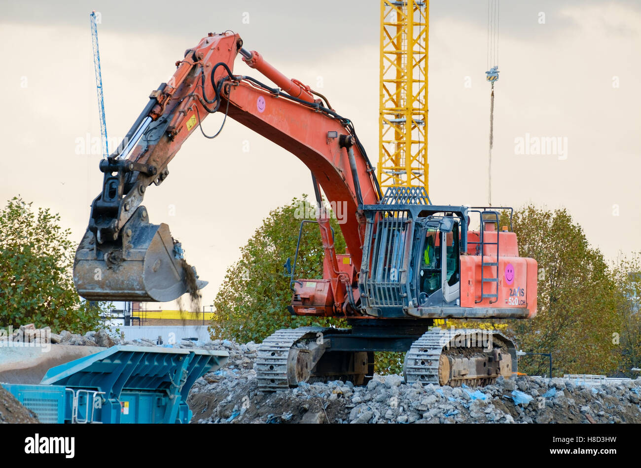 Tracked excavator working on construction site in East London, England Stock Photo