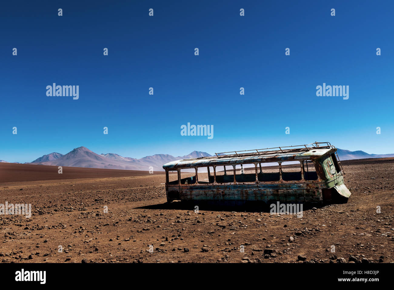 Abandoned bus in the desert in the Potosi Department in Bolivia; Concept for travel in the desert and travel in the Andes Stock Photo