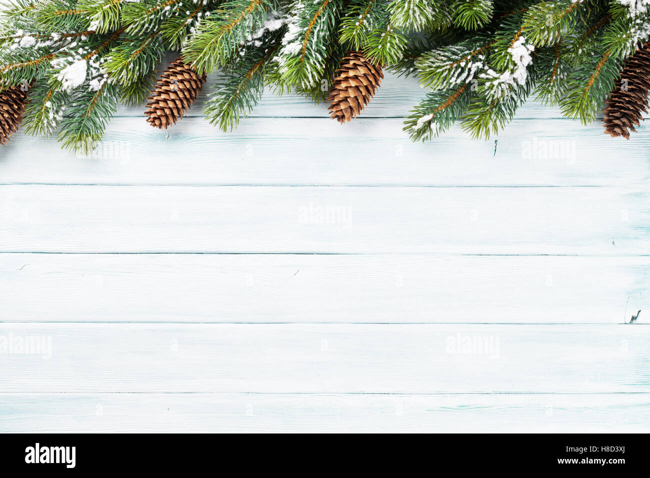 Christmas wooden background with snow fir tree. Top view with copy ...