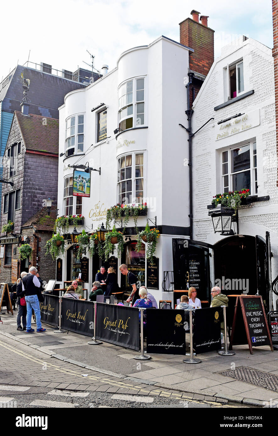 The Cricketers pub with people drinking outside in The Lanes area of Brighton UK Stock Photo