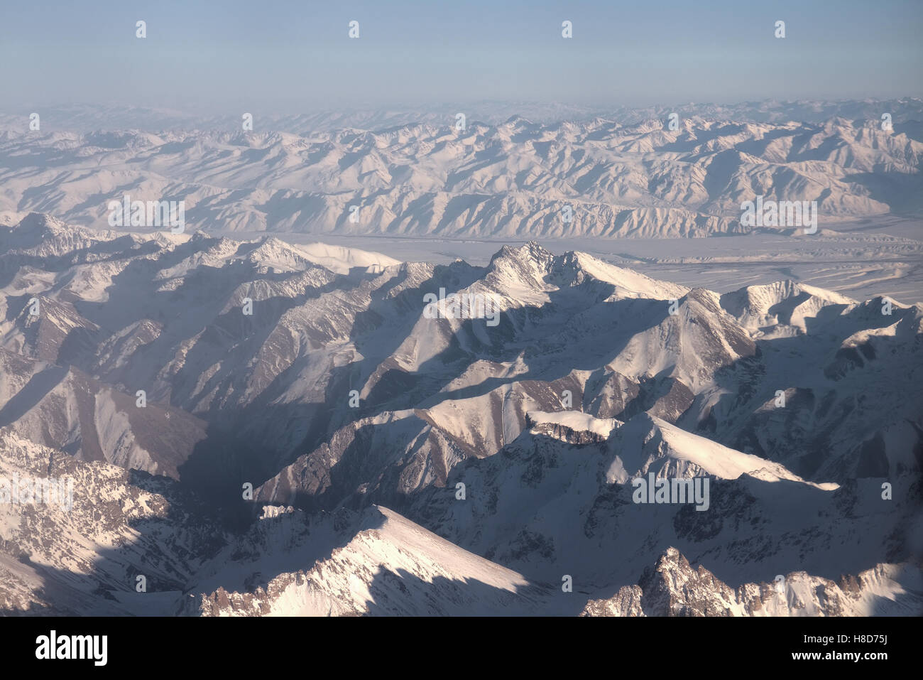 Parallel Mountain Ridges Flight over Pamir and Tien Shan 1. Air travel. Visible deep mountain ...
