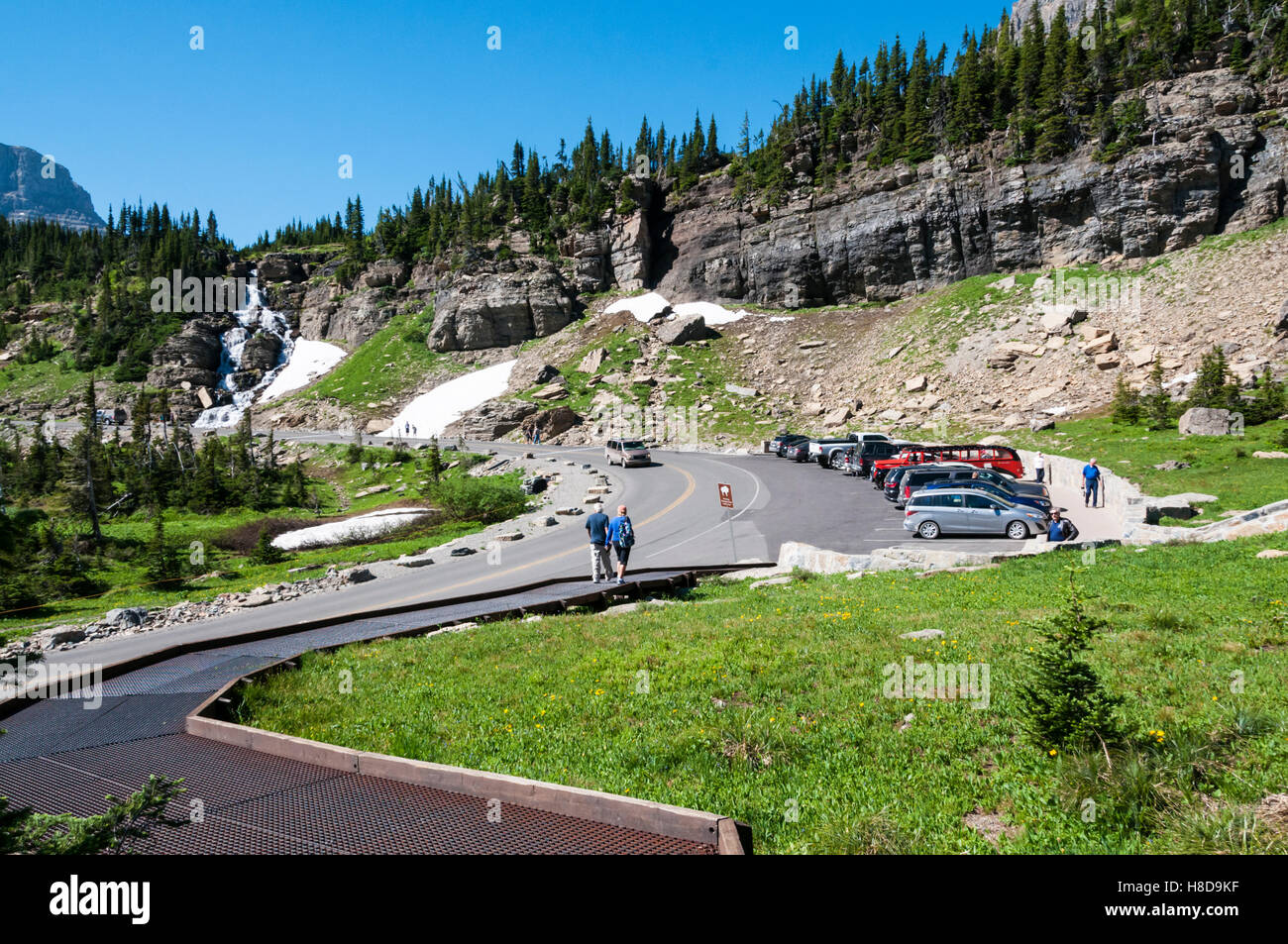 Cars parked at the Oberlin Bend on the Going-to-the-Sun Road in Glacier National Park. Stock Photo