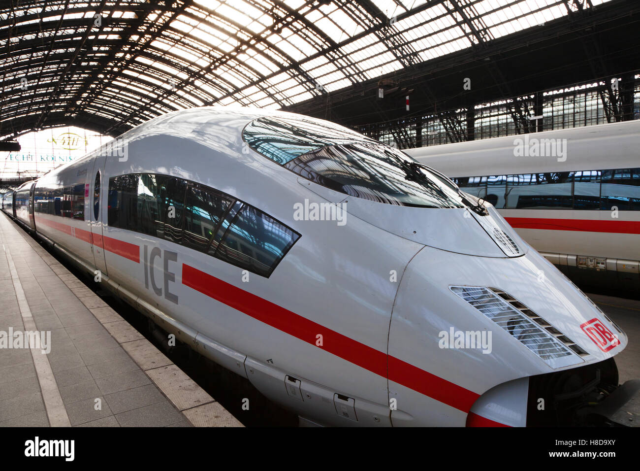 An Intercity Express train of Deutsche Bahn stays in the Cologne train Station in Germany Stock Photo