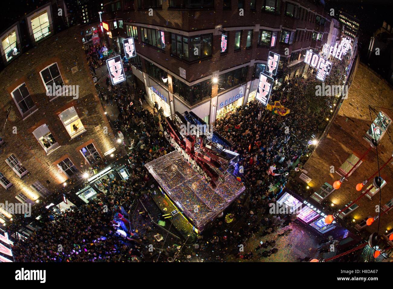 EDITORIAL USE ONLY Crowds gather for the Carnaby Christmas lights switch-on in Carnaby Street, London, in collaboration with the V&A and elrow, celebrating the heritage of Carnaby's fashion and cultural revolutions since the late 1960s. Stock Photo