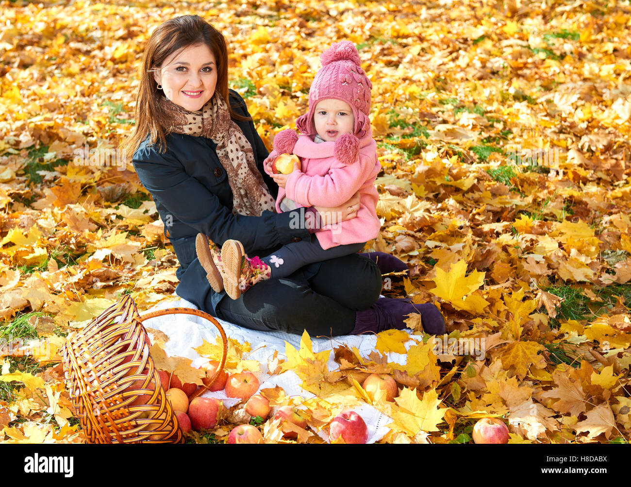 Woman with child girl in autumn city park, happy family Stock Photo - Alamy