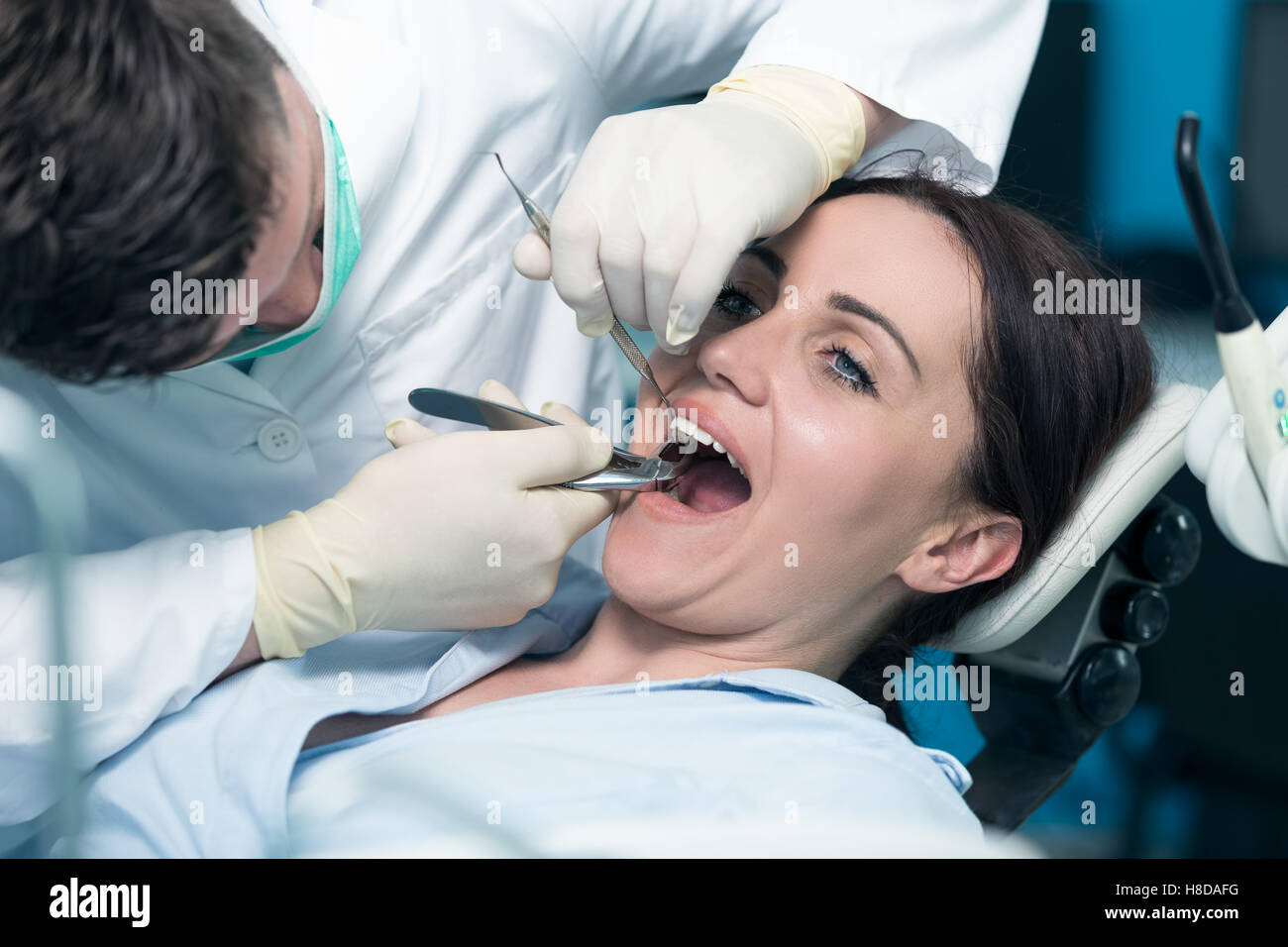 Dentist examining Patient teeth with a Mouth Mirror Stock Photo Alamy