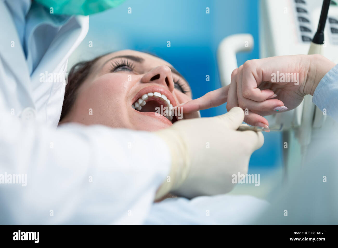 Dentist examining Patient teeth with a Mouth Mirror Stock Photo Alamy