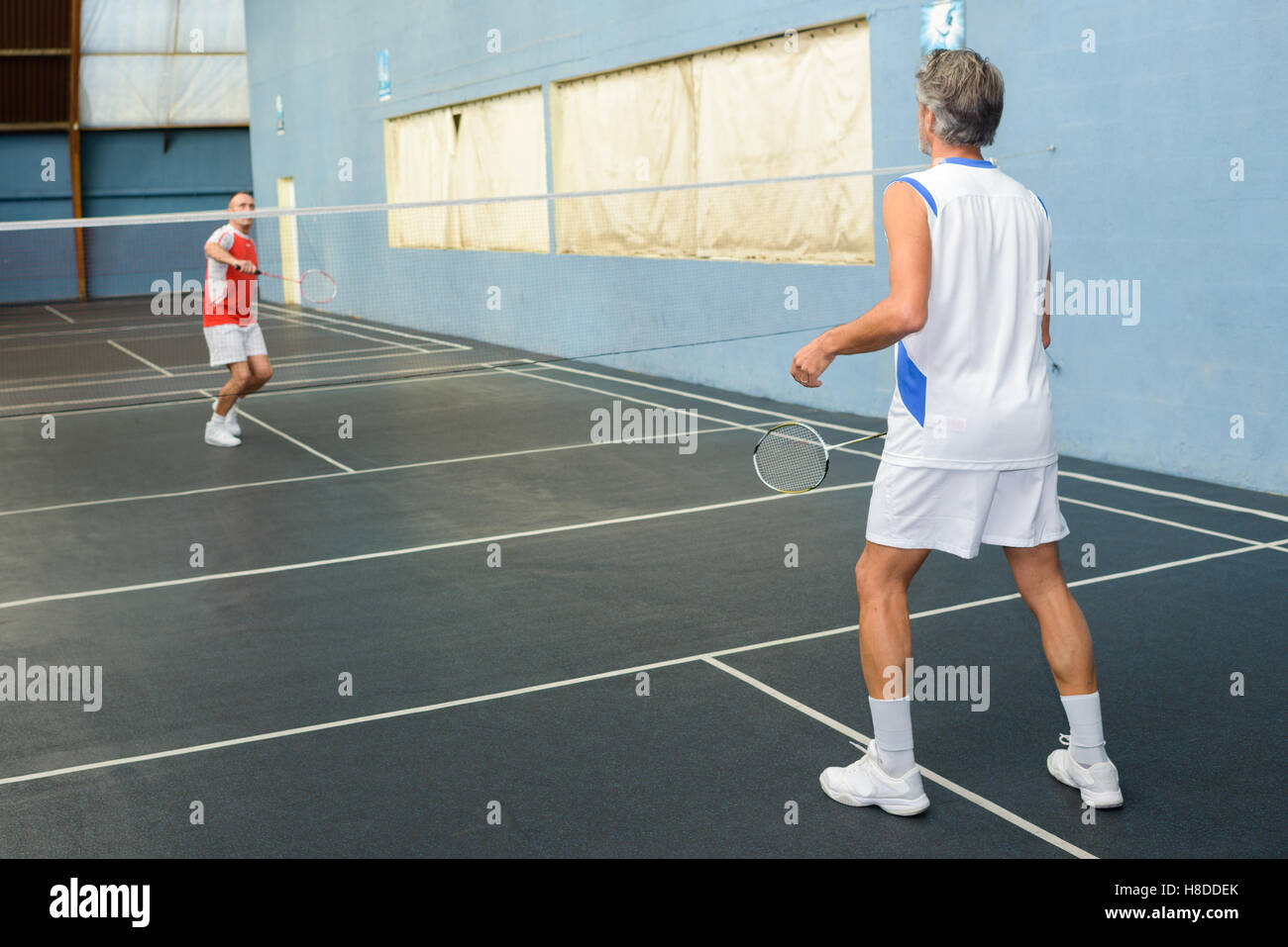 badminton game in progress Stock Photo Alamy