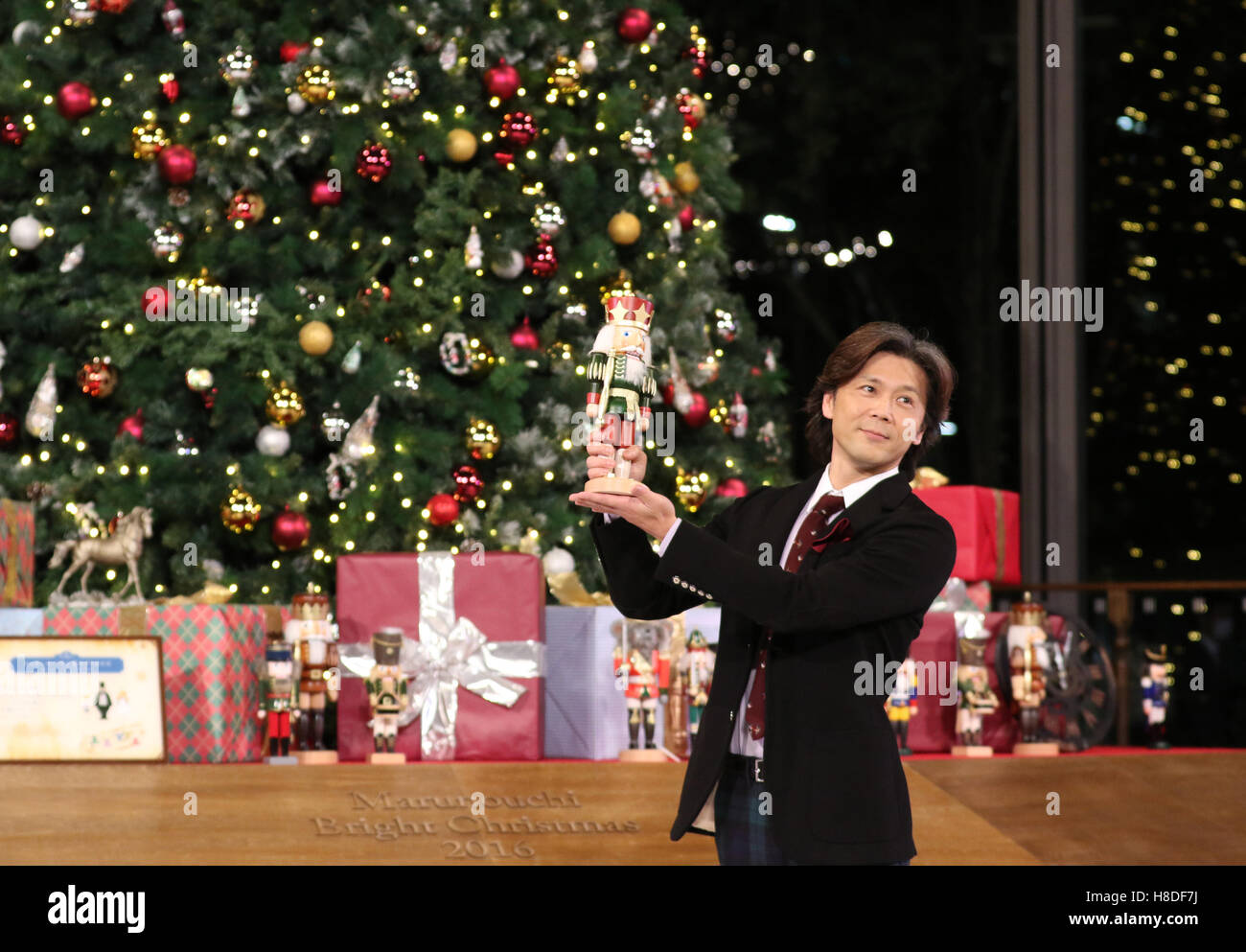 Tokyo, Japan. 10th Nov, 2016. Tetsuya Kumakawa, Japanese ballet dancer and director of the K Ballet Company holds a nutcracker as he attends the light-up ceremony of a large Christmas tree at the Marunouchi building in Tokyo on Thursday, November 10, 2016. The Marunouchi area started illumination and decoration with motif of ballet dance Tchaikovsky's 'Nutcracker' through the Christmas Day. © Yoshio Tsunoda/AFLO/Alamy Live News Stock Photo