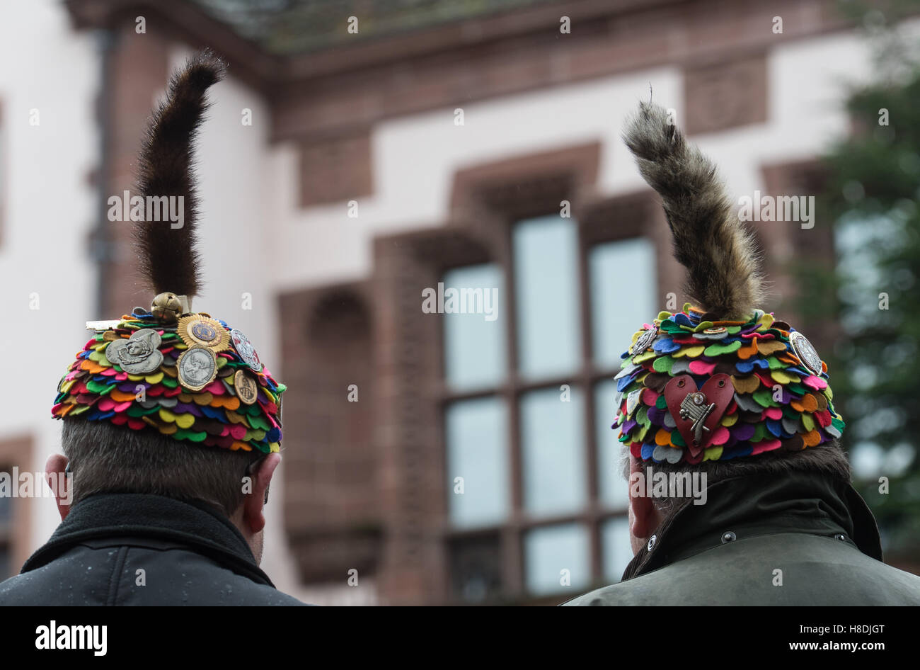 Freiburg, Germany. 11th Nov, 2016. Members of the Carnival club of Freiburg standing in front of the city hall during the traditional keg tapping in Freiburg, Germany, 11 November 2016. The carnivalists wear a colourful fool's hat with a cat's tail. PHOTO: PATRICK SEEGER/dpa/Alamy Live News Stock Photo