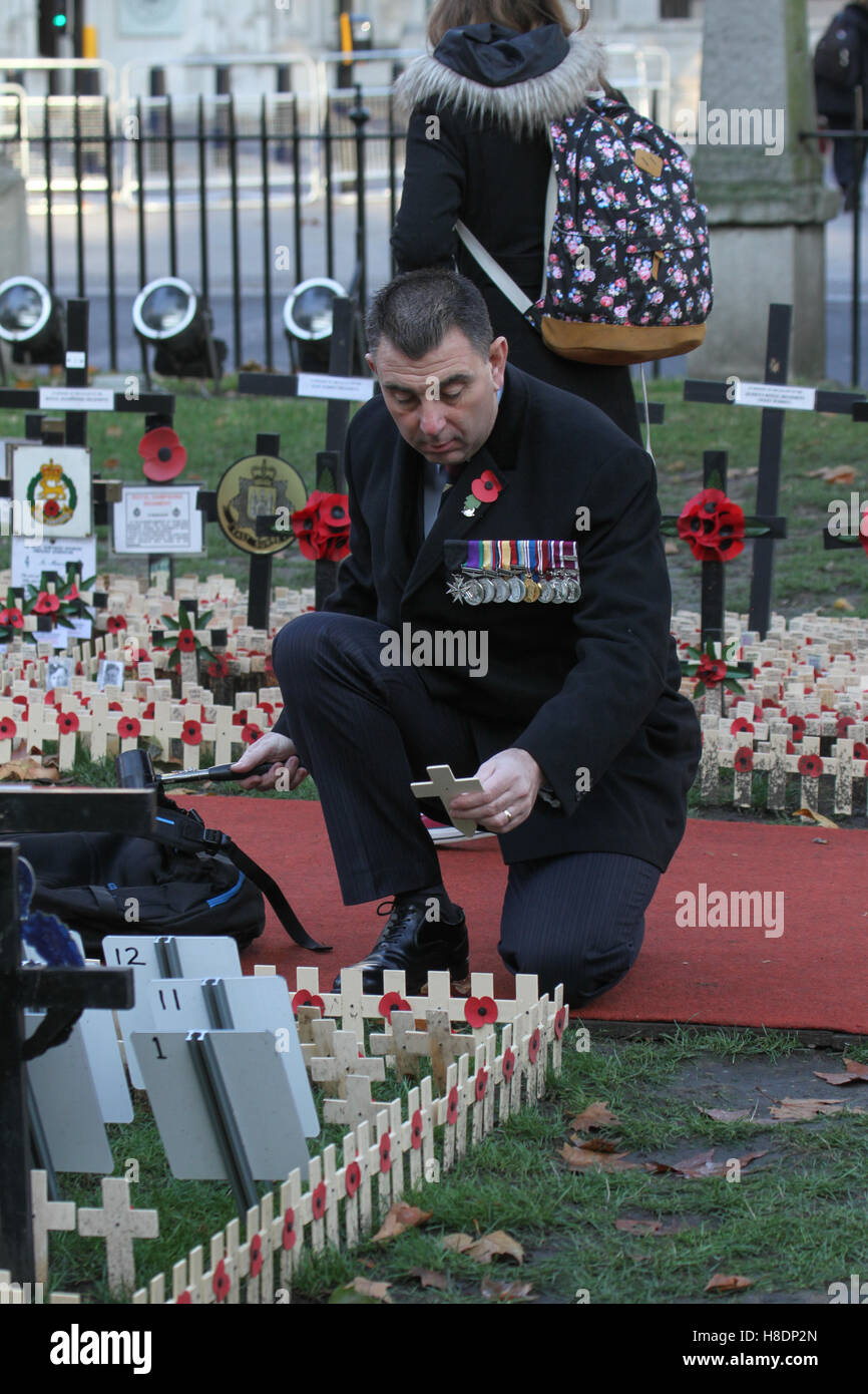 London, UK. 11th November, 2016. Thousands of crosses planted at the Fields of Remembrance at Westminster Abbey in London to remember the men and women who have lost their lives in conflict. on November 11, 2016. The first official Armistice Day was subsequently held on November 11, 1919 on the grounds of Buckingham Palace. Credit:  David Mbiyu/Alamy Live News Stock Photo